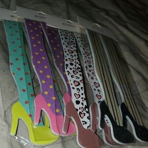 4 packs (a total of 8) Bright and funky high heel style finger nail files.